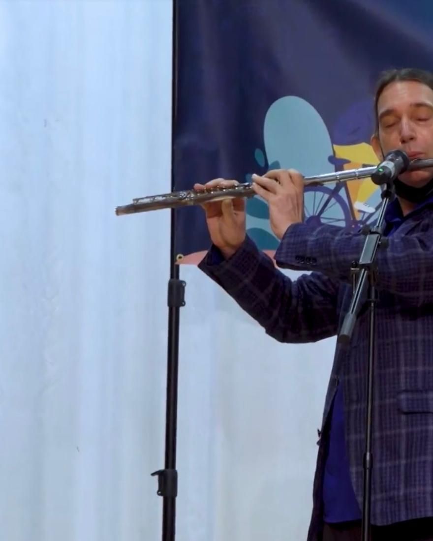 Dan on flute, eyes closed